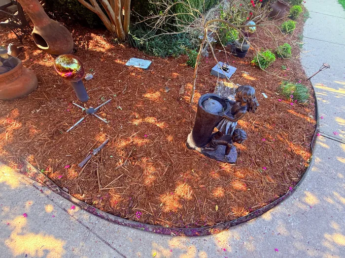 Freshly mulched flower bed with clean edging